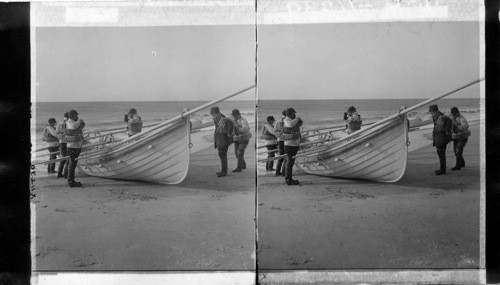 Life saving corps with boats ready for action on Long Island Beach. N.Y