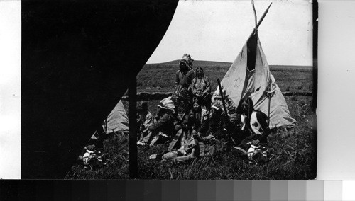 Life among the Sioux - Family at breakfast before their tent wigwam, Cannonball Reservation, North Dakota