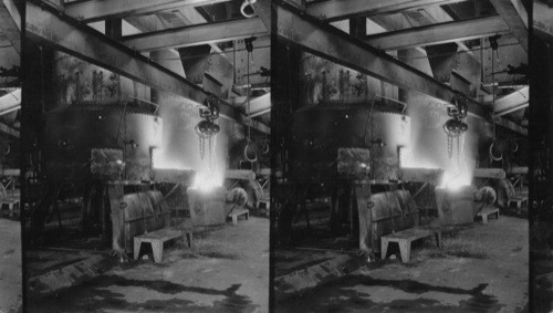 Filling ladle from cupola with foundry metal used to make tractor motors, etc. Ford Motor Plant, Detroit, Mich