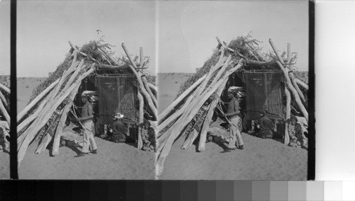 Navaho Blanket Weaving - An Indian Hogan (hut) on the Navajo Reservation, Arizona