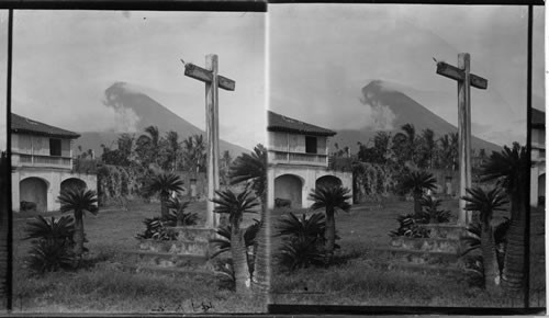 Mayon and the cross draped in misty splendor, Island of Luzon, P.I