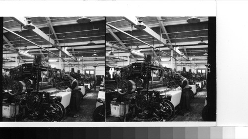 Rochdale: in one of the loom rooms of the Kessall and Kemp woolen mills, where the operator tends four machines. The cloth woven here is dyed after weaving