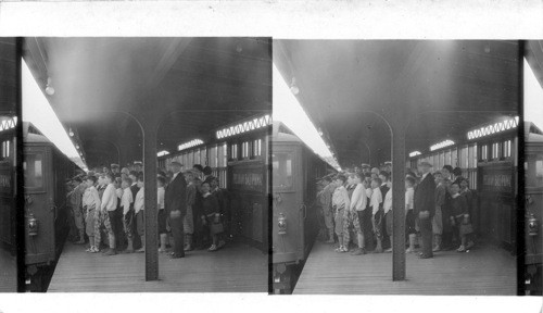 N.Y. City school Children taking train of the Interborough Rapid Transit at the subway station at Pilham Bay Parkway after a days outing