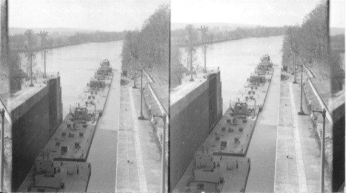 Boat and oil barges entering the lock. ? Tennessee, Georgia, Alabama