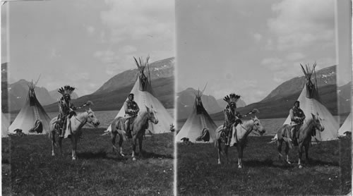 Chief Two Guns White Calf and another Indian Mounted in Camp. Glacier National Park. Montana