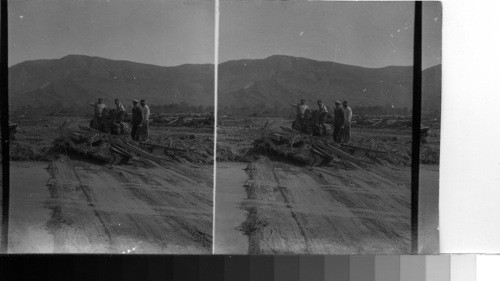 Cleaning up a street in Santa Paula, where homes stood before the flood