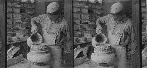 Casting of a china plate, worker pouring "slip" (liquid clay composed mainly of clay, feldspar and flint) in mold,"Lenox Inc." makers of fine china ware, Trenton, N.J