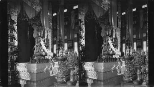 Interior of Chinese Lama Temple, Chicago, Ill, Side view along front row showing the Central Figure (Avalokitecvara, whose incarnation was Dali Lama in Lhasa, the Patron Saint of Tibet) flanked by Pagodas and fronted by many Lamanistic symbols and sacrificial gifts