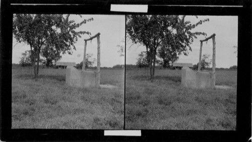 San Felipe, Texas. This well was dug by the colonist of Stephen F. Austin under his direct supervision. It was from this well that water was drawn that supplied the colony. The little log cabin in the background is an exact replica of Stephen F. Austin's home & is on the spot where his home stood. #7