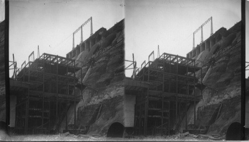 Showing the penstocks & main lines high tension, 110,000 volts, lines looking south, Power Plant. Canada