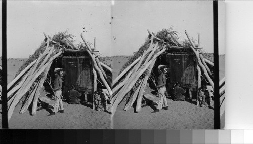 Navaho Indian Blanket Weaving - An Indian Hogan (hut) on the Navajo Reservation, Arizona