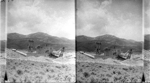 Gold dredge near Leadville, Colo. On the road to Buena Vista. Gold is taken out by amalgamation. Working in a stream bed it had been up & down this valley a distance of 3/4 of a mile perhaps 12 times. Reported to have taken about $1000 of dust and nuggets per day. Apparently stalled for lack of water