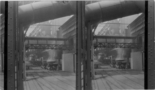 Blast furnace in background. In foreground ladle is being filled with Molten slag, Ladle capacity 10 to 12 tons. Ford Motor Plant, Detroit, Mich