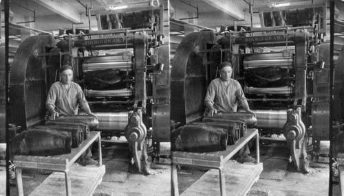 Tread calendar having four rolls, feeding the rolls with stock coming from "warm-up", mill, Akron, Ohio