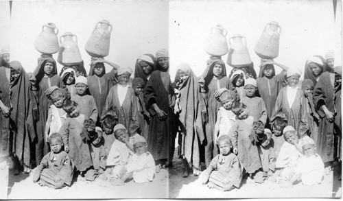 Water carriers and children, Egypt