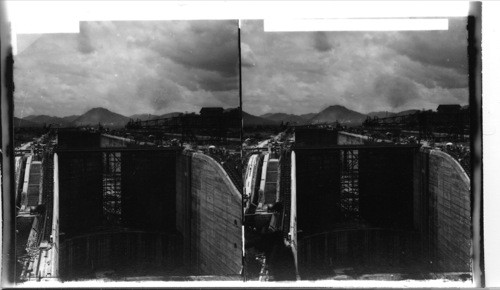 Looking north from west basin Miraflores, showing inclines from lower to upper locks. Panama