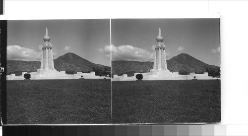 San Salvador, El Salvador, C.A. The monument to the patron saint of Salvador - city and country - "El Salvador del Mundo" (Savior of the World) stands on the outskirts of the capital [capitol] city. San Salvador rises in the distance