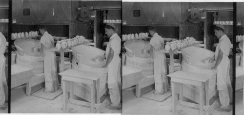 "Applying glaze to bisk" All ware is called "bisk" before it is glazed. "Lenox, Inc." Makers of fine chinaware, Trenton, N.J