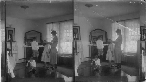 Woman washing little girls face. Meadville, Pa