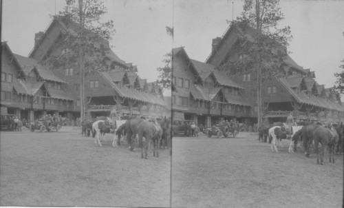 Auto Bus Leaving Old Faithful Inn Showing Saddle Horses Waiting for Party