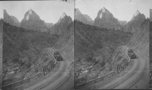 From highway looking up to the Three Patriarchs. The three Patriarchs are so large and so in line that it is impossible to include the three in one shot even using wide angle unless a two days trip is taken and is necessary to climb among rock all the way to a Mt. No trail and then there would be not foreground. Zion National Park. Utah. See Peabody's 47320