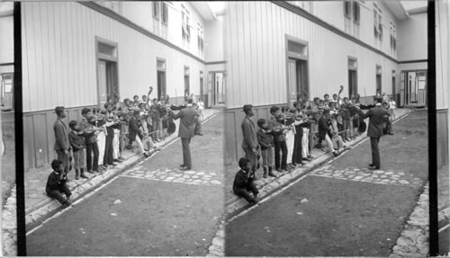 A School Orchestra. A Rehearsal of Stringed Instruments. Guayaquil, Ecuador