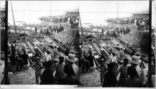 Market stalls in canoes along the waterfront with vendors and customers, Guayaquil, Ecuador