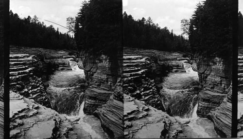 Famous natural steps and hurrying stream above the Falls of Montmorency, near Quebec. Canada