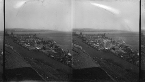 Looking down from Citadel over Dufferin Terrace with part of old Quebec below the wall toward the harbor showing Empress of Britain, Ship of the C.P. Line, Canada