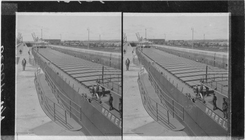 "Whale back" freighters of ore and grain in canal. Sault Ste. Marie, Mich