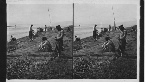 Fishermen Mending Nets at Jordan’s Entrance to Sea of Galilee. Palestine