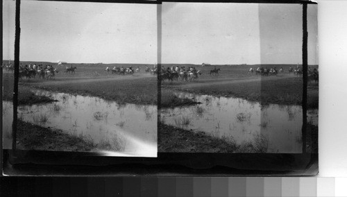 Indians Riding from Camp to the Agency, where the Sham Battle takes place. Fort Belknap Reservation, Mont., July 1906