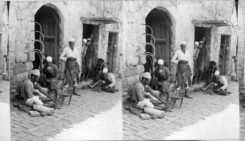 Sickle sharpening during harvest, Nazareth, Palestine