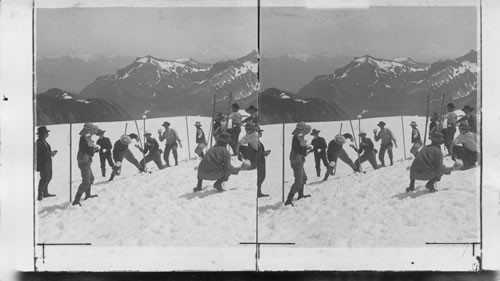 A July Snow Fight on Mt. Rainier. Washington. U.S