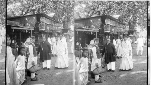 The Bird shops in the market of Bombay. (A Parsee and his wife are seen in the foreground). India