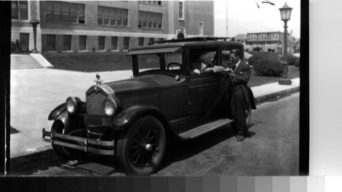 Keystone Photographer's car with Mr. Bert Garai of London office and Philip Brigandi, photographer