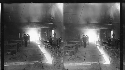 River of molten metal in steel mill. "Running a Heat," Molten Iron Flowing from a Monster Blast Furnace. Homestead, Penna