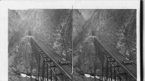 Chaupichaca Bridge and tunnel where Oroya R.R. 9472 ft. above the sea assault nature's barrier. Peru