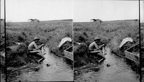 Army viewer taking a bath in a stream