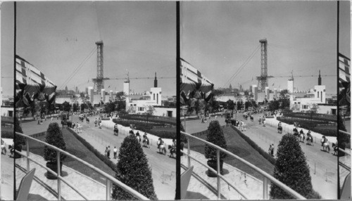 The Firestone Building has a commanding position at the end of the Lief Erickson Avenue. The view shoes a parade turning into the Avenue which leads north to the Hall of Science building. From the Firestone balcony