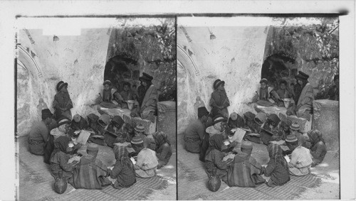 Little folks at their lessons in the village school at Ramah, Palestine. No. 723-1200. W. T