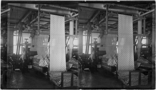Lawrence, Mass. [Shows yards of cotton fabric layered in bin.]