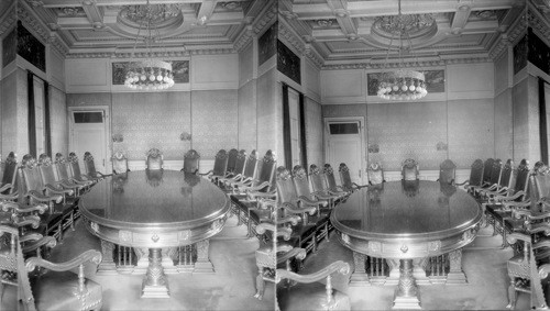 Governing Board room of the Pan-American Union in the Pan-American Bldg., Wash. D.C. The table is made of mahogany from the Dominican Republic. Bronze frieze around upper parts of walls by Sally James Farmham