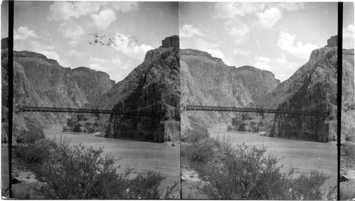 The Kaibab Suspension Bridge looking up Granite Gorge of Colorado River - Grand Canyon, Arizona