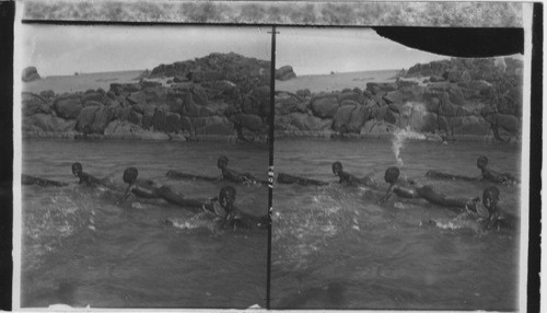 Nubian Boys Shooting the Rapids of the Nile on Logs, Egypt