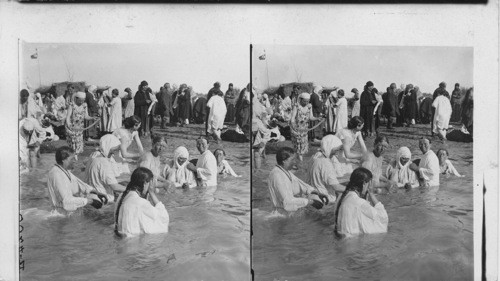 Pilgrims bathing in the Jordan River, Palestine