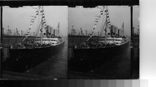 The S.S. Deutschland at her pier in New York. just before sailing