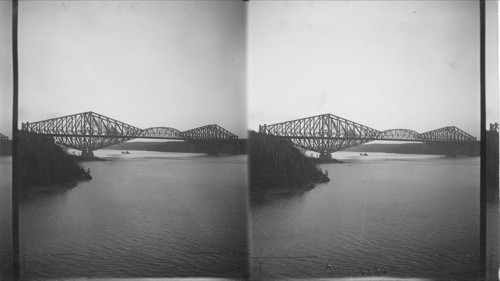 Quebec Bridge about seven miles west of Quebec, looking west up St. Lawrence River. Quebec, Canada