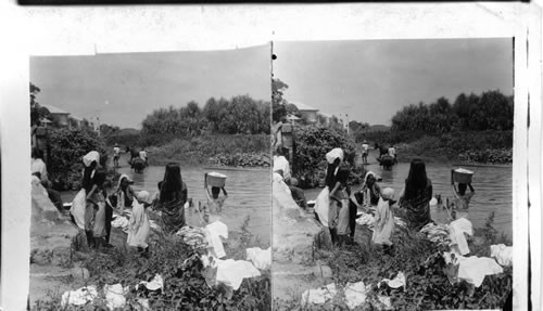 Lower Class Housewives Doing Their Washing. Manila. P.I