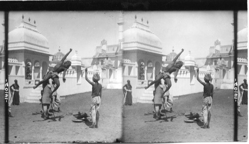 A native athlete doing the “high jump” in the courtyard of the Raja’s Palace, Udaipur, India